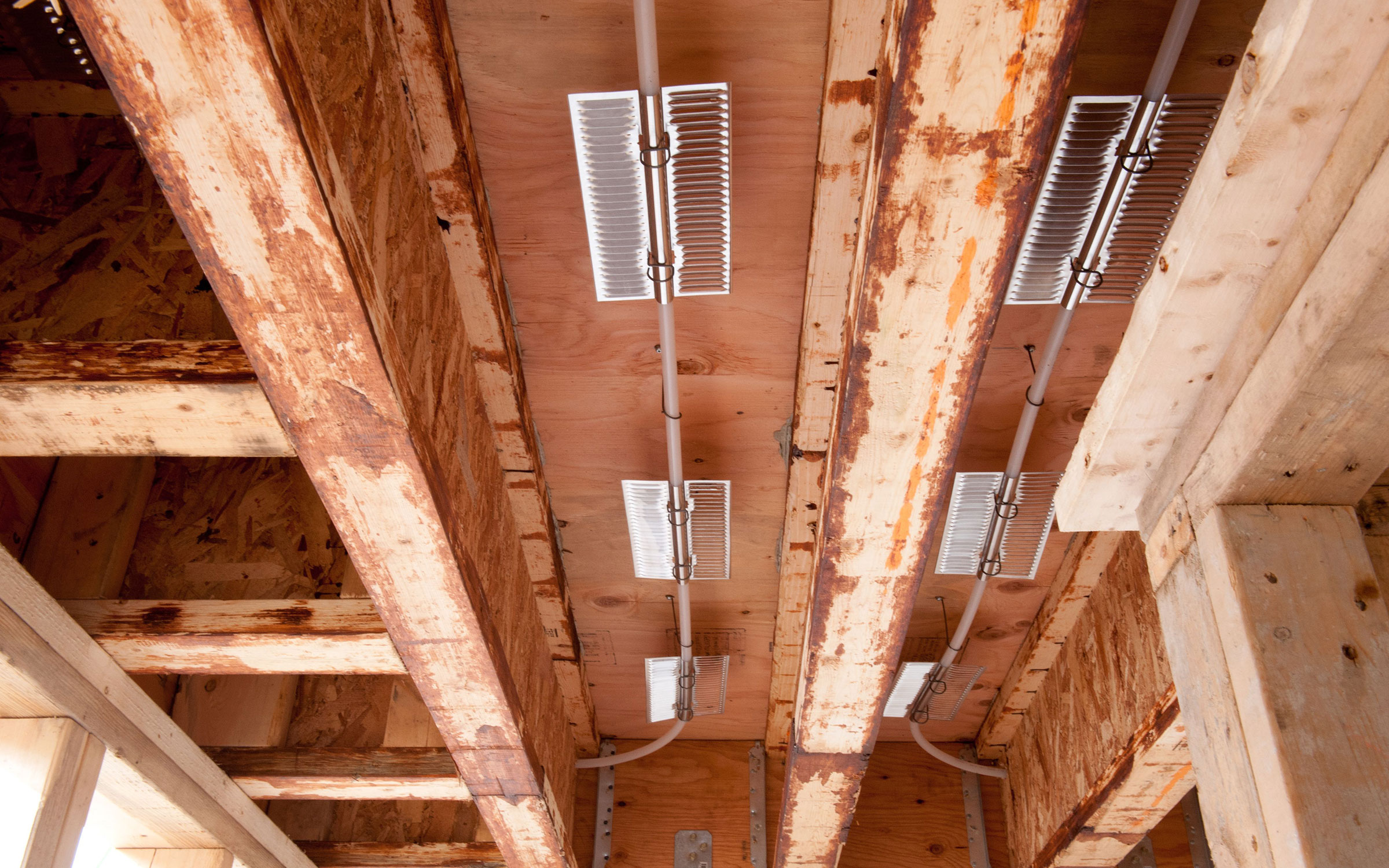 Ultra-Fin aluminum fins installed between floor joists